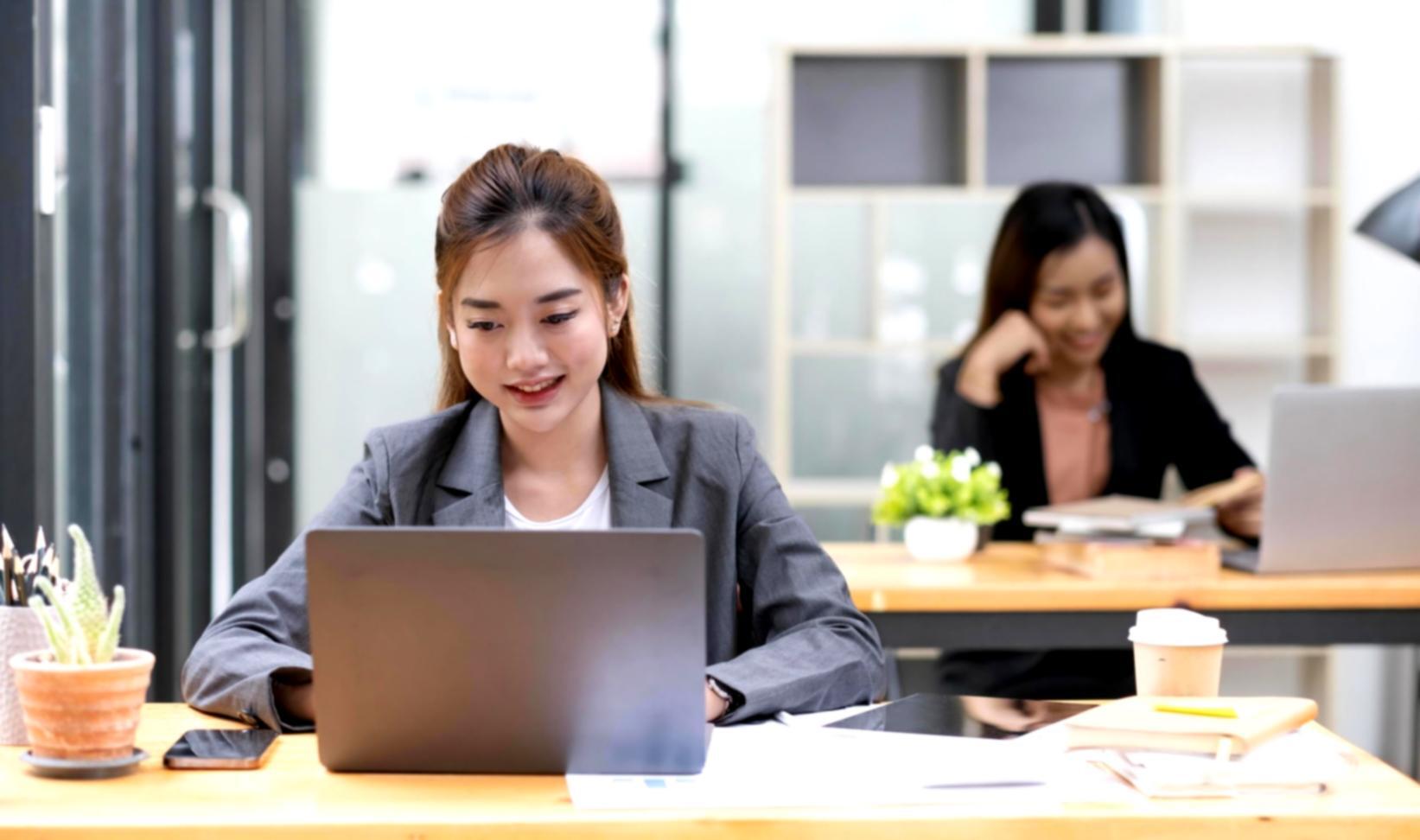Financial professionals collaborating on analysis projects in a modern workspace